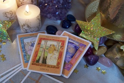 A picture containing three Tarot Cards