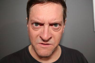 Close-up of an angry, intimidating man with a tense expression, symbolizing aggression and emotional intimidation.
