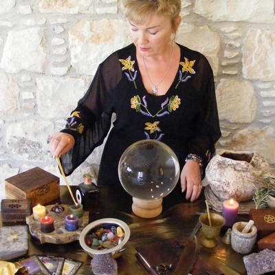 Casting a Spell! Woman at a table.