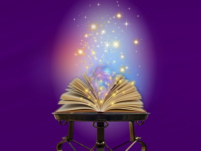 An open book emitting sparkles like magic.