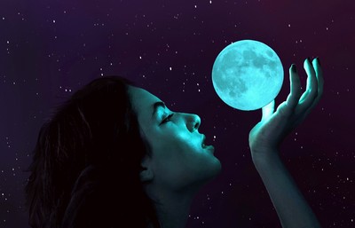 Image of girl appearing to be holding the moon