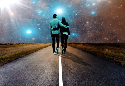 Couple walking under the stars to the future