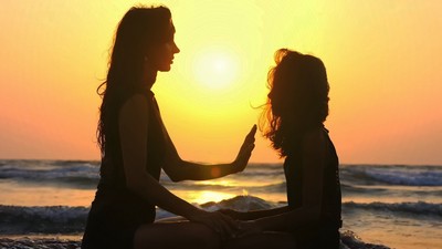 woman and child on beach