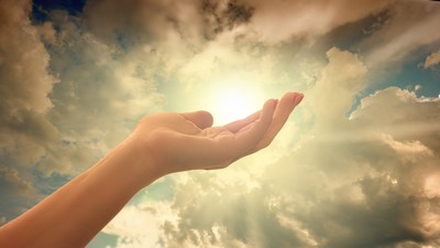 A hand reaching out to the Sun A hand reaching out to the Sun