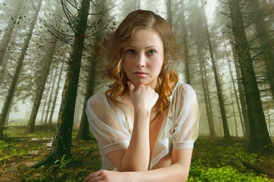 Woman in a forest thinking deeply