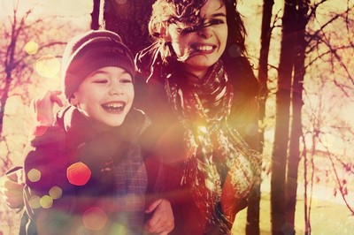 A woman and child enjoying their time in some woodland