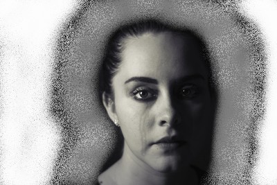 Image of woman's head surrounded by a tainted Aura