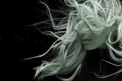 A woman's long hair blowing in the wind A woman's long hair blowing in the wind