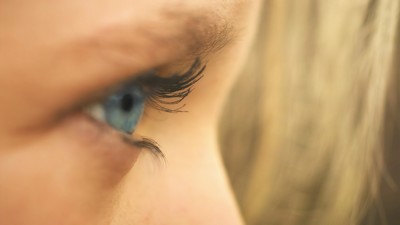 close up image of a person's eye looking right