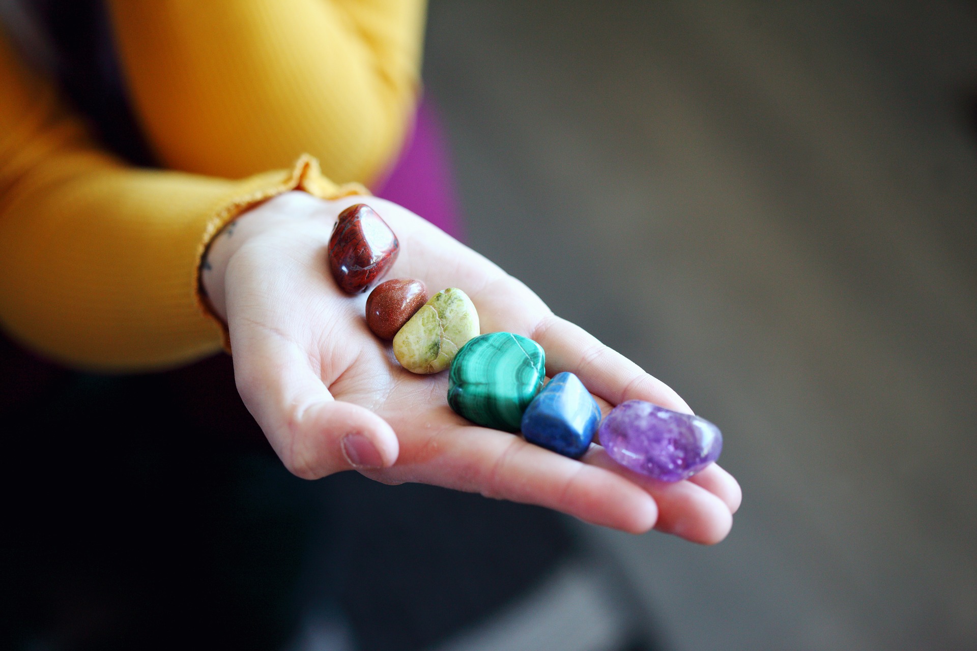 A selection of Crystals in the palm of a hand