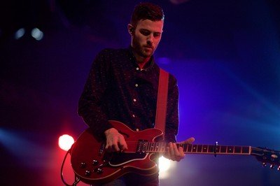 A man playing the guitar.