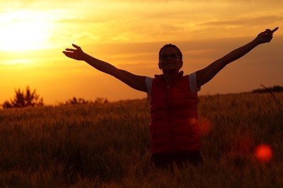 person joyous at the sunrise