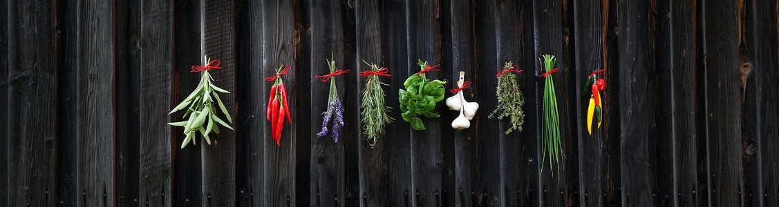 Mixed herbs and spices hanging on the wall