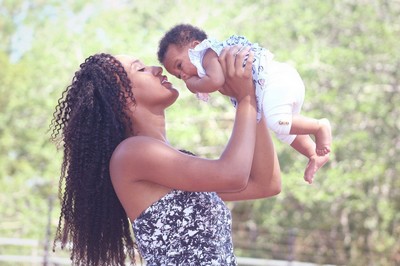 A mother holding her baby.