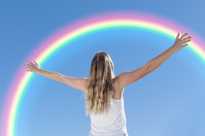 woman under rainbow