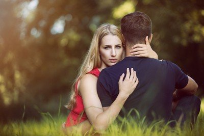 a romantic hug between and young man and woman
